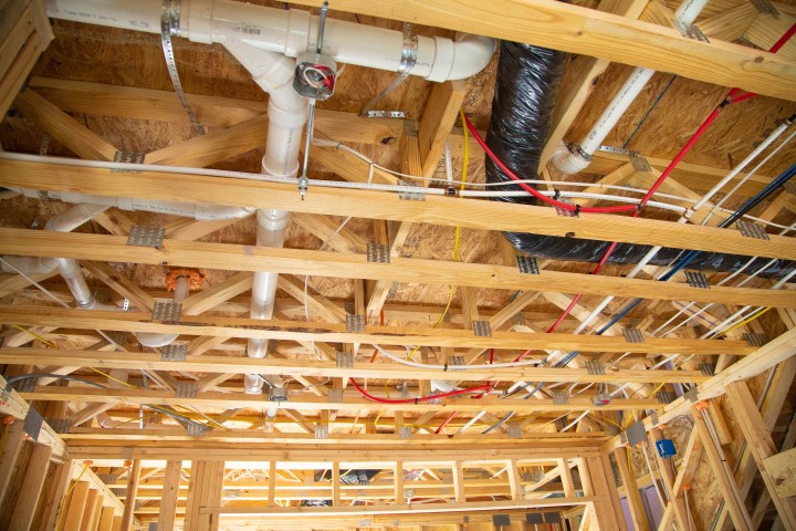 A good display of how open web trusses allow for easy implementation of plumbing and wiring